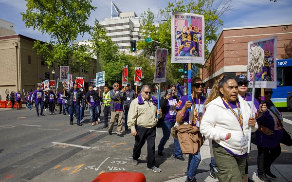 SEIU AND SEIU-USWW workers marching towards the State Capitol.